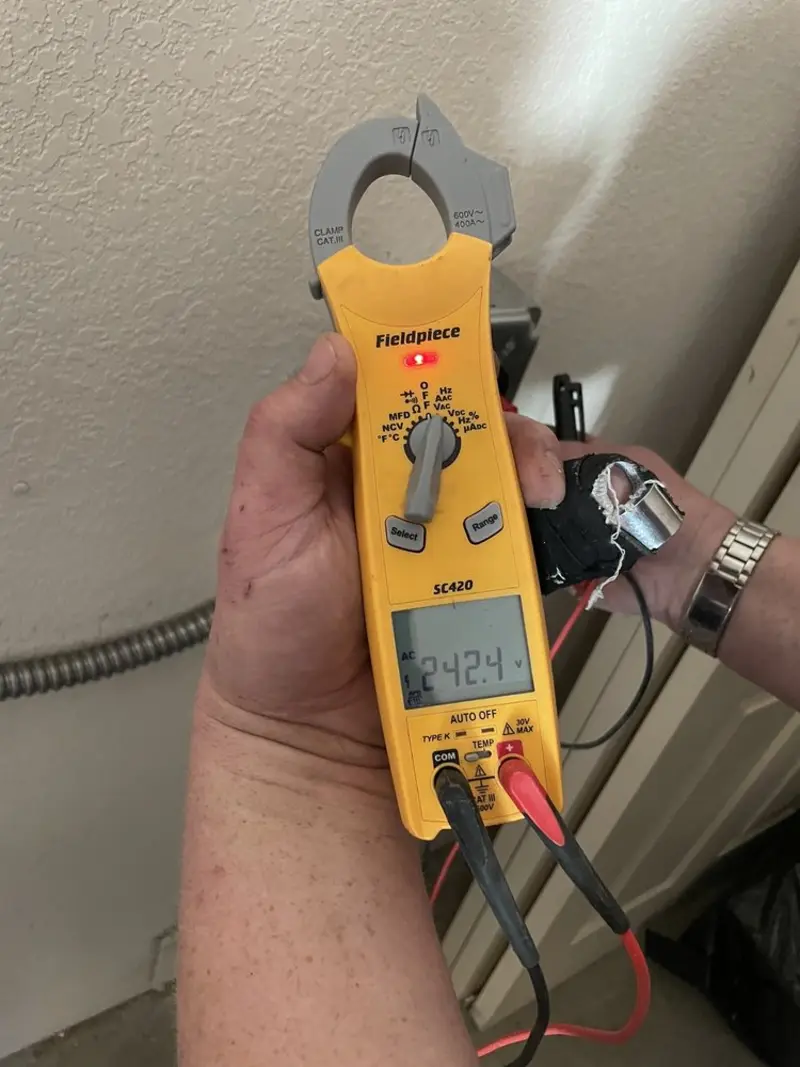 Voltage testing with clamp meter during Ceiling Fan Installation in Chestertown